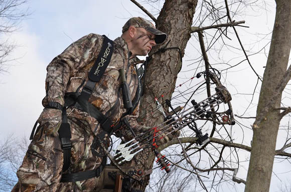 hunter on treestand looking down