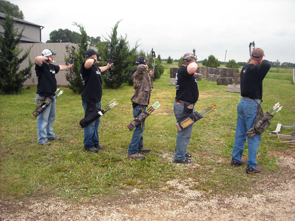 Archers shooting with hip quivers on.