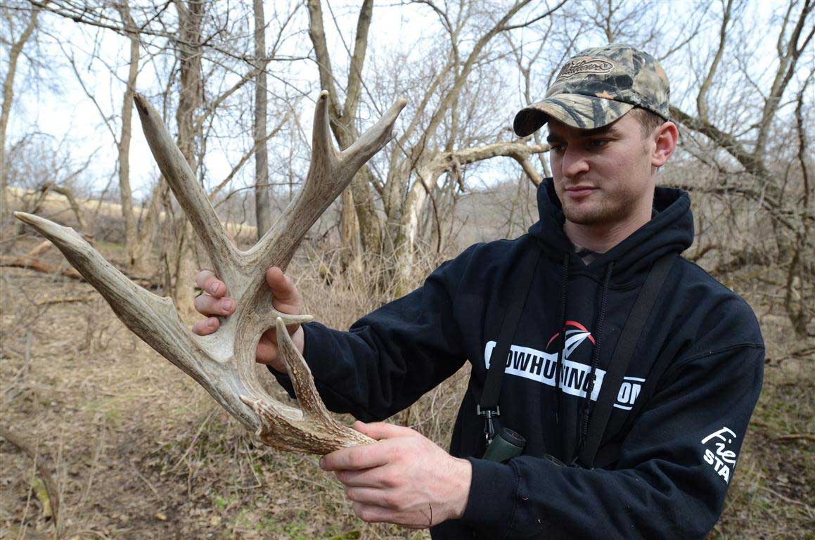 Hunter looking at shed antler