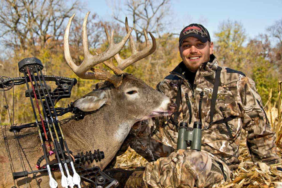 Hunter with whitetail buck