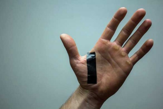 Electrical tape on bow hand