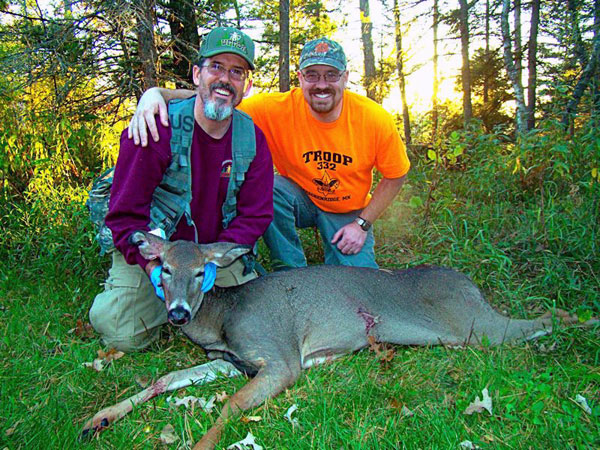 Hunter with doe Hunter with whitetail doe