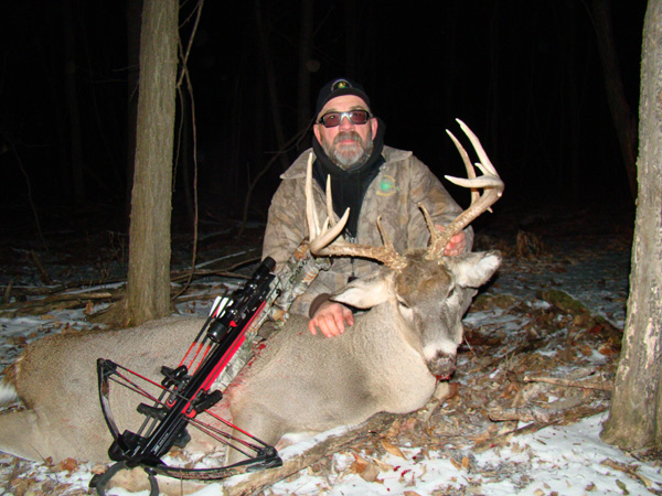 Crossbow hunter with buck