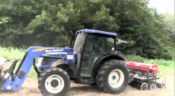 New Holland tractor with seed drill