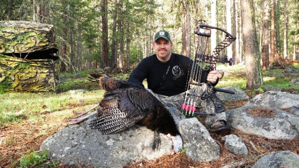 Hunter with Turkey and Blind