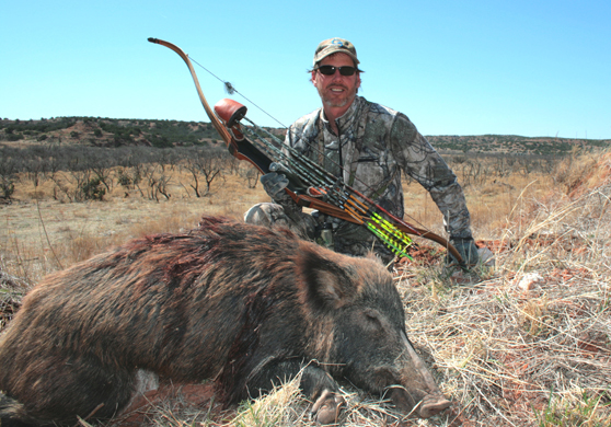 Hunter with Arrowed Hog