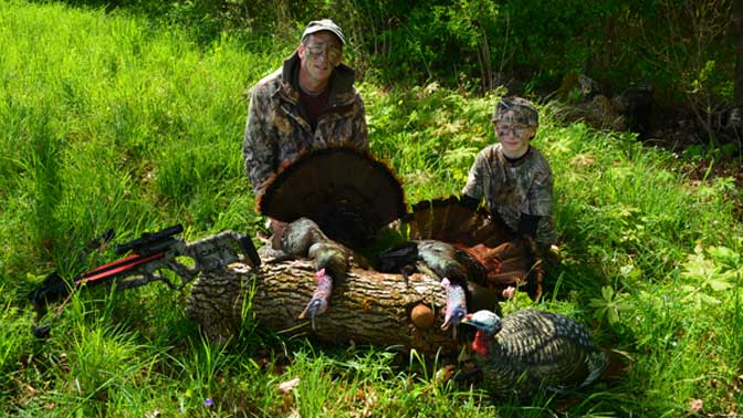 The Authors son, Ethan, at age 10 with his first Pennsylvania Spring Gobbler and the CAMX Chaos crossbow.