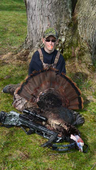 Ethan, at age 11 with his second Pennsylvania Spring Gobbler taken with a Bowtech Strykezone 350.