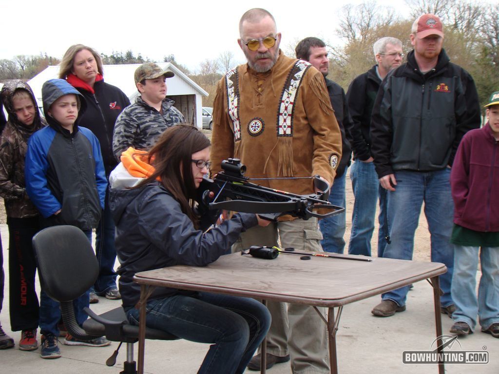 Heidi Larson takes her turn at the table with the Matrix Cub during the sighting-in process with the Douglas County 4-H Shooting Program meeting.