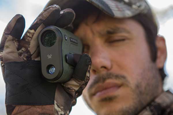 Hunter using rangefinder