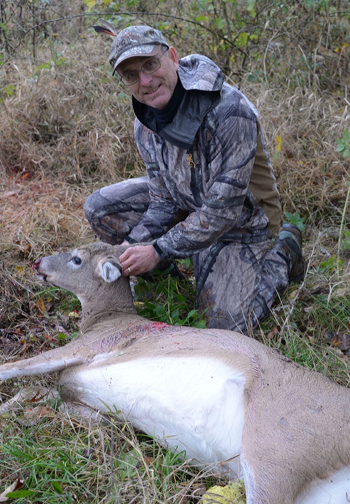 hunter with dead deer