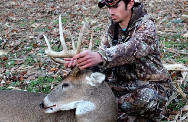 hunter with buck