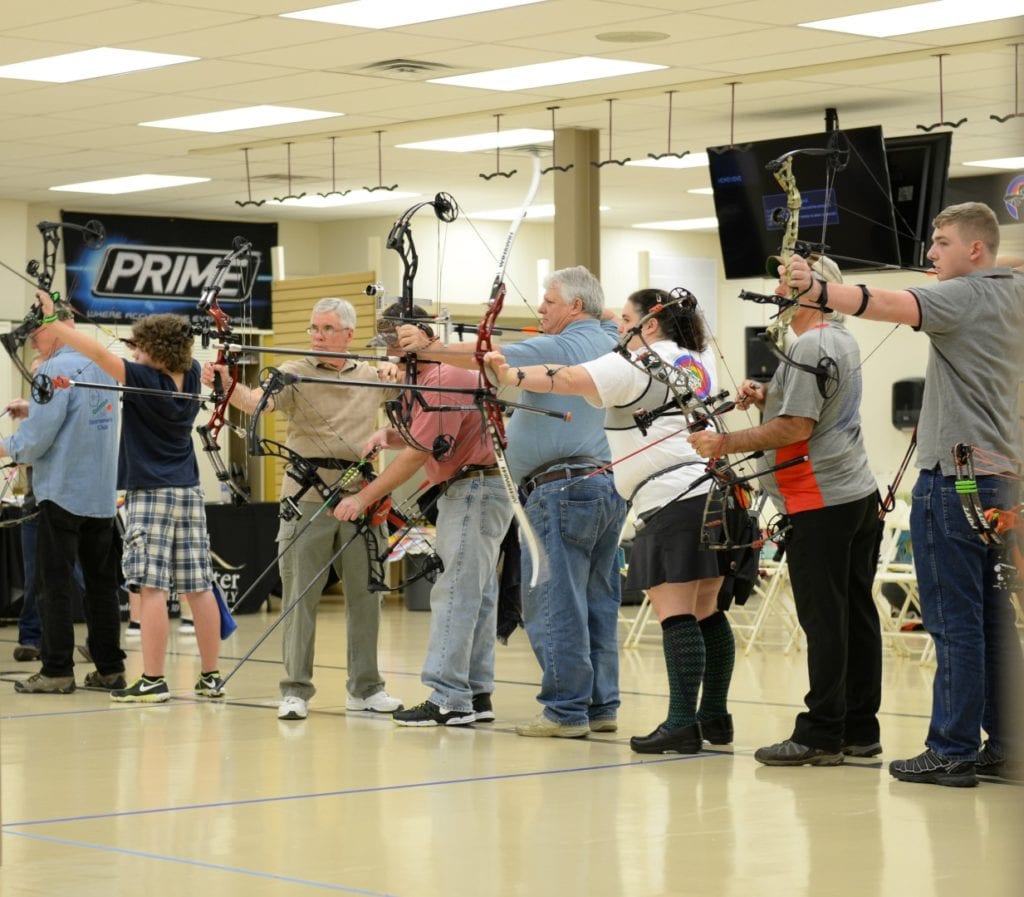 archers shooting at indoor targets