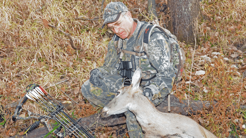 Bowhunter with doe