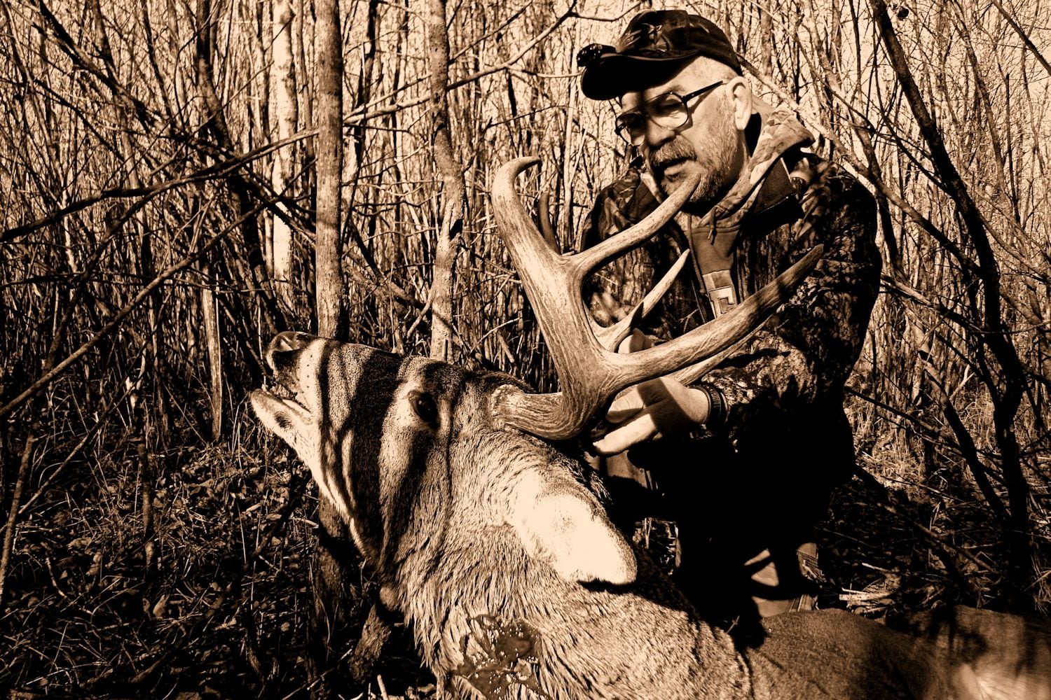 hunter with buck