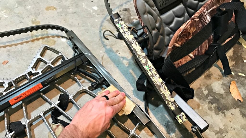 Buck Bumper tape being applied to a climbing treestand