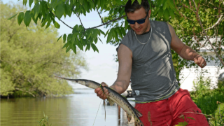 bowfisherman with gar