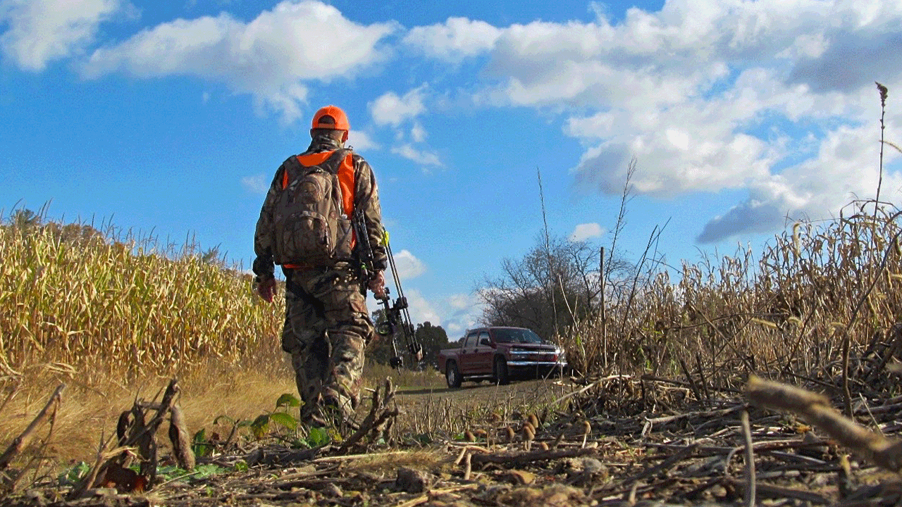 hunter walking in field