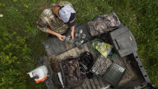 hunter using trail cameras