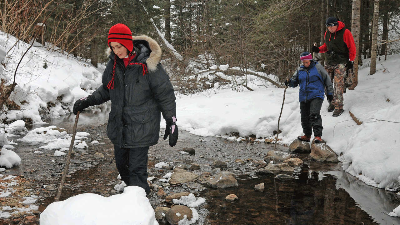 hunters for conservation - hikers-crossing-creek