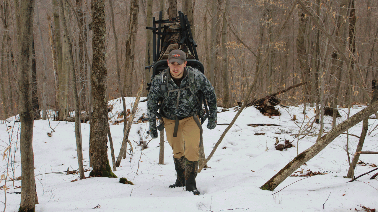 hunter-with-treestand-in-snow