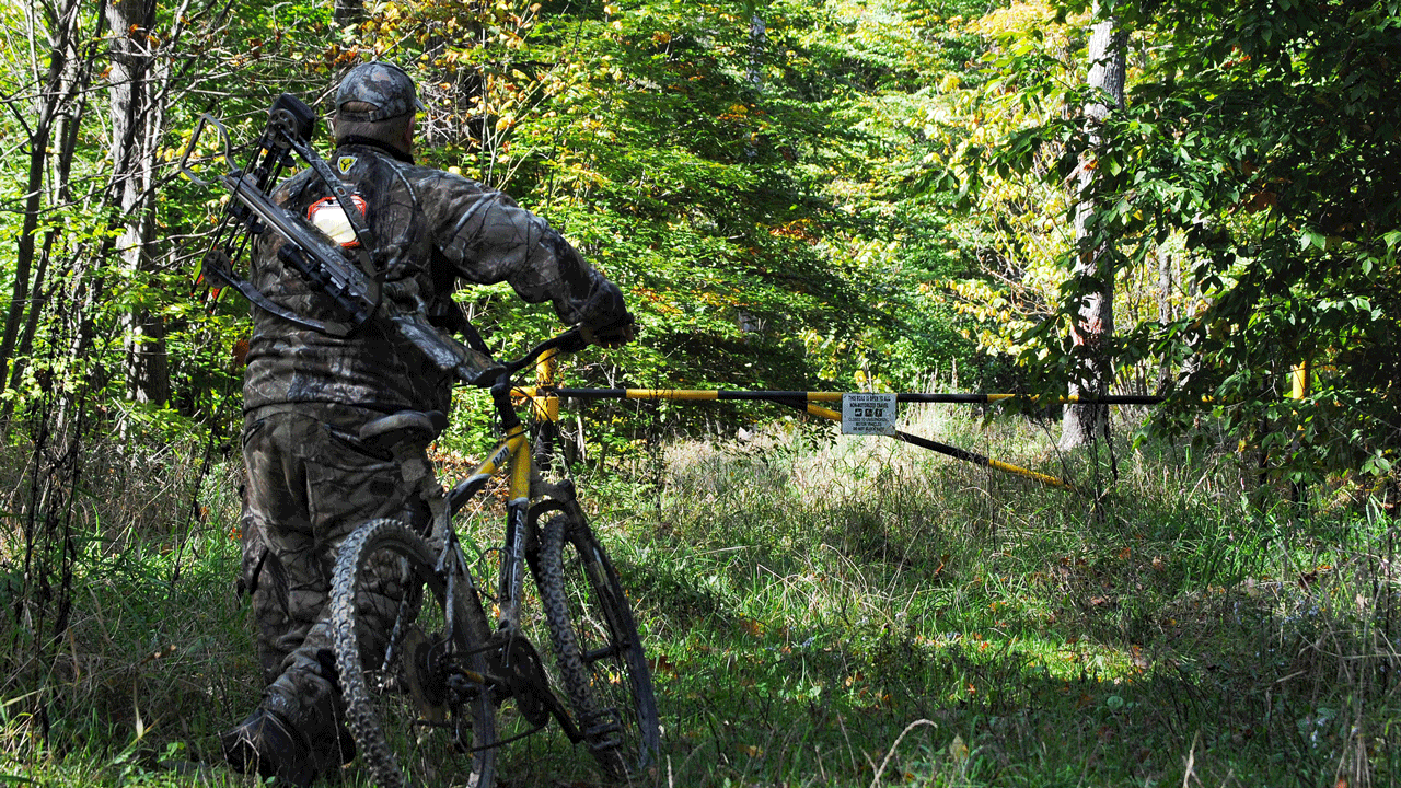 run-n-gun bowhunting tactics for the rut - hunter-with-bike - Run-and-Gun-1