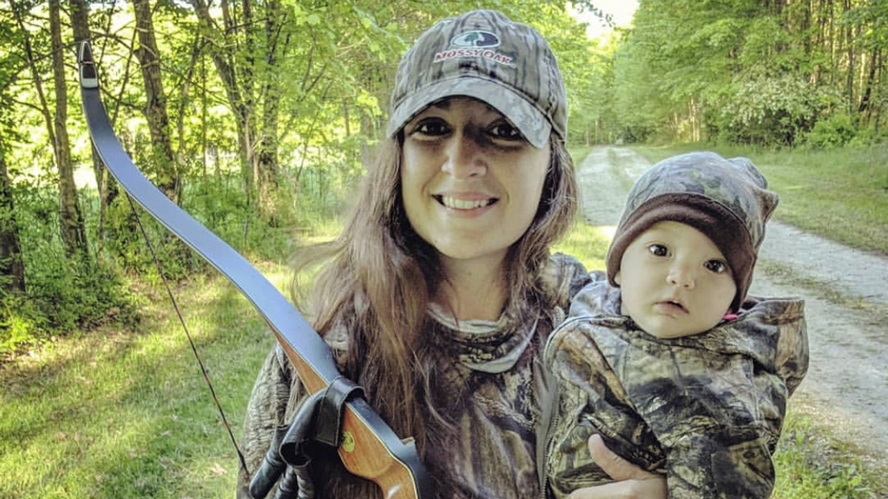how to hunt with a baby - beka-with-bow-and-baby