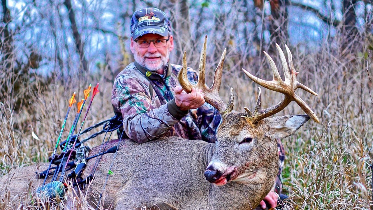 hunter with buck