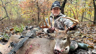 ben rising with buck and his bow