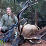 Pennsylvania hunter Michael Skvarla posing in the timber with his potential state-record 428-inch bull elk and crossbow.