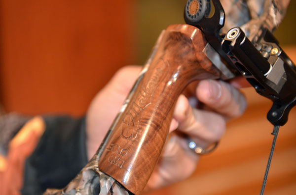 Close up view of the Heli-M's walnut grip